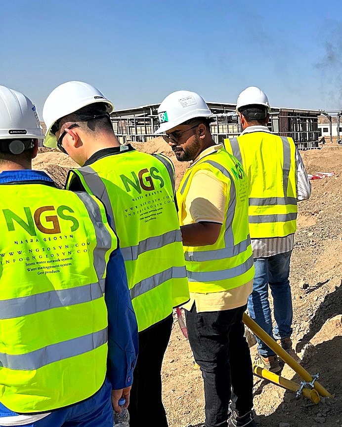 NGS engineering team reviewing work at a Saudi project site